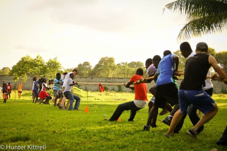 A group of friends playing tug of war